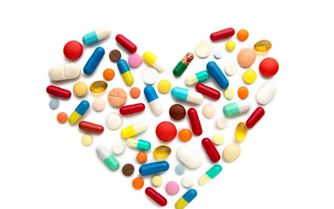 Some different pills in a heart form